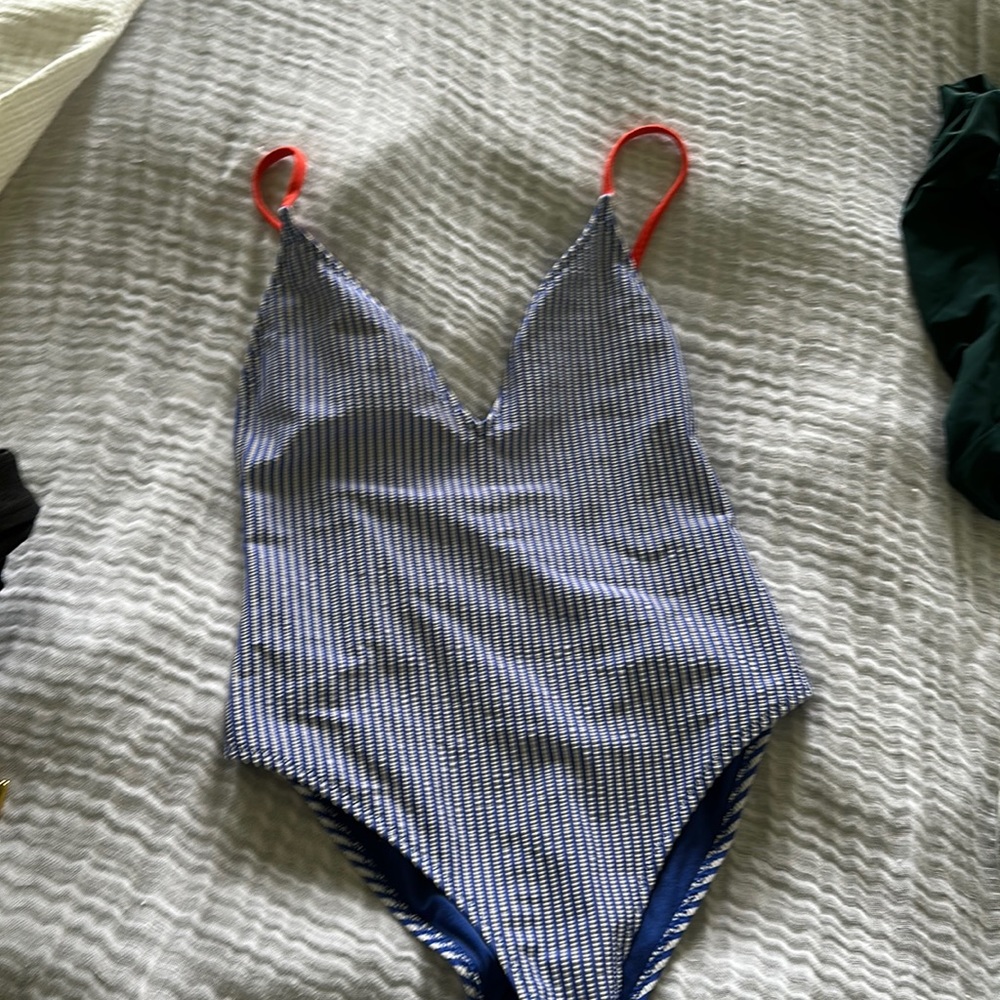 Blue and white stripe with bright pink striped one piece bathing suit